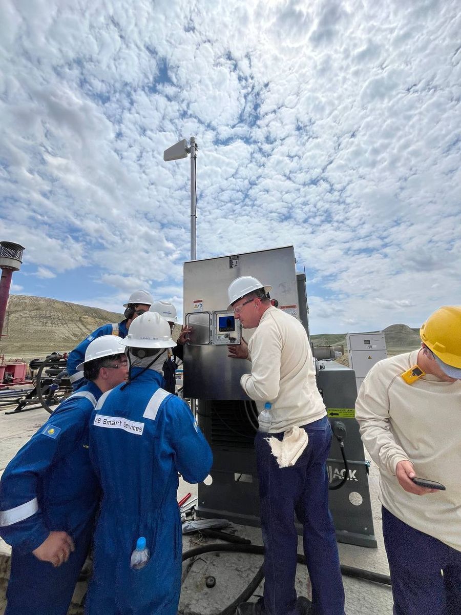 ABSS technicians at a control panel in the field